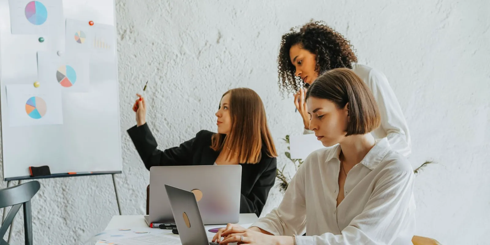 A team planning an office move around a table